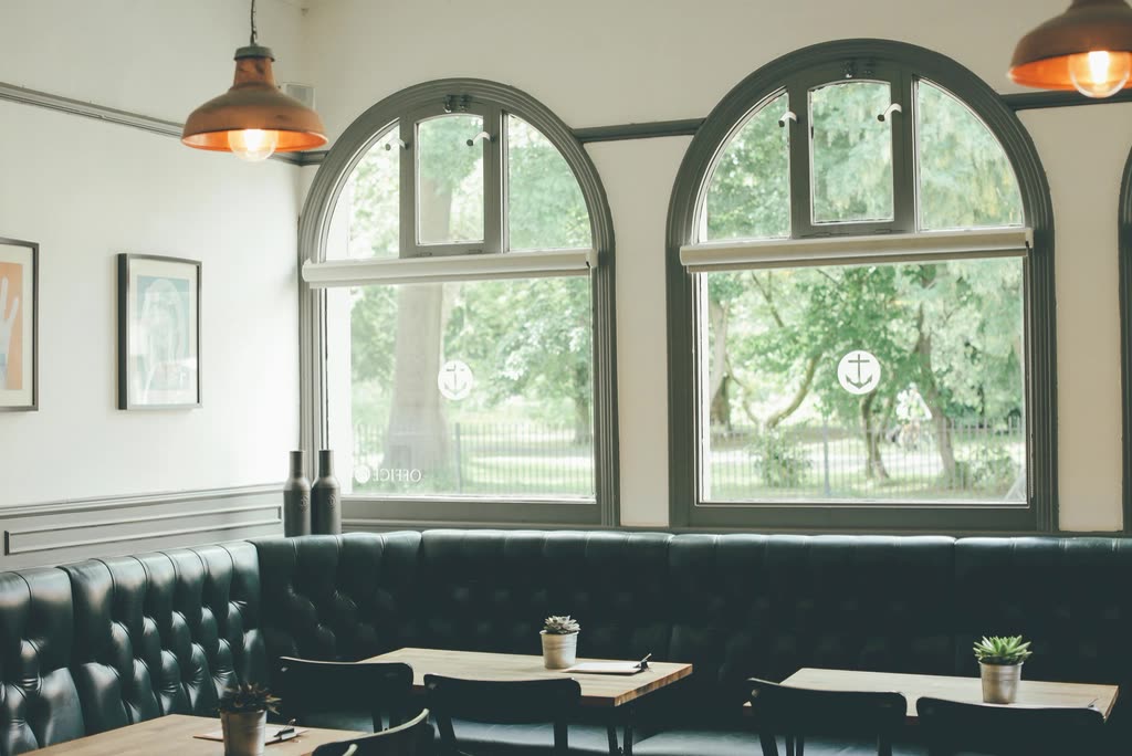 Arched windows empty café — 카페 창업 비용 평균, 왜 한 숫자로 답이 안 되나
